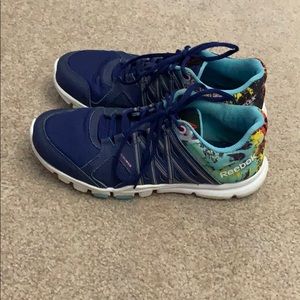 Blue and multicolor Reebok athletic shoes.